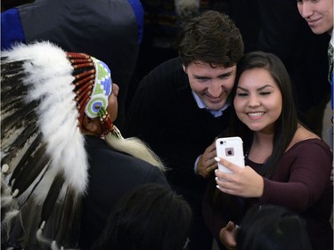 Prime Minister Justin Trudeau stops for photos after meeting with the leaders of the File Hills Tribal Council at the Treaty Four Governance Centre in Fort QuíAppelle Saskatchewan Tuesday April 26, 2016.