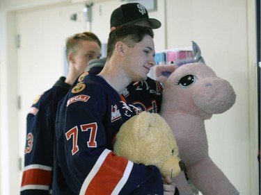 Members of the Pats including captain Adam Brooks were presenting their teddy bears collected during the Teddy Bear Toss at last Friday's game to kids at the Regina General Hospital.