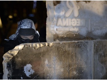 Local artist Leo Pantel worked on an ice sculpture at the Light the Lights event.