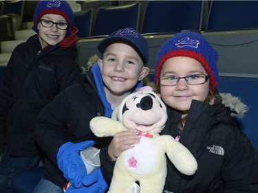 Tanner, Lukas, and Sydney Gallenger at the Teddy Bear Toss at the Pats game.