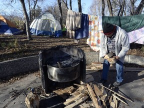 Harley Clippenstine starts packing up camp in November after he was told a group of homeless people using the picnic site in Wascana Centre as a home would have to leave.