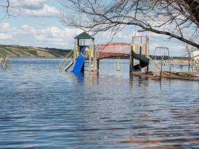 A playground structure sits underwater in Manitou Beach in August as water levels rise on the lake.