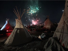 CANNON BALL, ND - DECEMBER 04:  Fireworks fill the night sky above Oceti Sakowin Camp as activists celebrate after learning an easement had been denied for the Dakota Access Pipeline near the edge of the Standing Rock Sioux Reservation on December 4, 2016 outside Cannon Ball, North Dakota. The US Army Corps of Engineers announced today that it will not grant an easement to the Dakota Access Pipeline to cross under a lake on the Sioux Tribes Standing Rock reservation, ending a  months-long standoff.