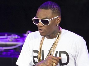 FILE - This Sept. 1, 2013 file photo shows Soulja Boy performing at the Verizon Wireless Amphitheater in Irvine, Calif. he rapper was charged Monday, Jan. 23, 2017, with felony weapon possession after police found an assault weapon and handgun that had been stolen from a police vehicle during a search of his Los Angeles home in December. (Photo by Paul A. Hebert/Invision/AP, File)