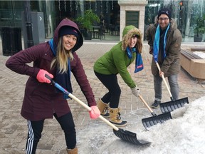 City staff Linh Le, Jennifer Fuller and Andrew Christoffel help kick off the annual Snowbusters campaign in Regina on Tuesday. The campaign encourages residents to shovel the walks of their neighbours throughout the city.