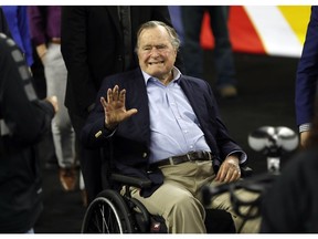 In this April 2, 2016, file photo, former President George H. W. Bush waves as he arrives at NRG Stadium before the NCAA Final Four tournament college basketball semifinal game between Villanova and Oklahoma in Houston. Houston-area media are quoting former President George H.W. Bush's chief of staff as saying that Bush has been hospitalized in Houston.