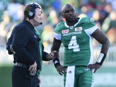 Head coach Chris Jones of the Saskatchewan Roughriders and Darian Durant #4 talk before the beginning of overtime against the Edmonton Eskimos during a game held at Mosaic Stadium in Regina, Sask. on Sunday Sept. 18, 2016.