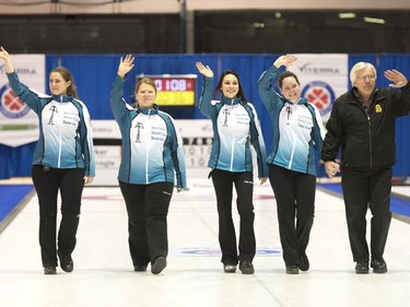 Penny Barker, Deanna Doig, Lorraine Schneider, Danielle Sicinski, and coach Merv Fonger are presented as the winners of the Scotties Women's Provincial final held in Melville, Saskatchewan.