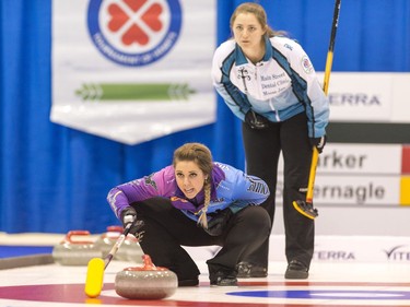 Robyn Silvernagle of North Battleford, bottom, calls out instructions while Moose Jaw's Penny Barker looks on during Sunday's provincial Scotties Tournament of Hearts final in Melville.