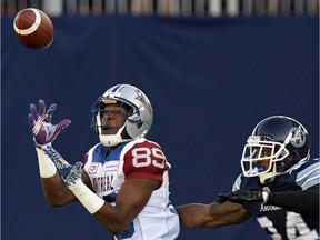 Montreal Alouettes' Duron Carter (89) intercepts the ball as Toronto Argonauts' A.J. Jefferson gives chase during first half CFL action in Toronto, Monday, July 25, 2016. Alouettes receivers Duron Carter and Kenny Stafford sent farewell tweets to Montreal fans this morning amid reports they have been released by the CFL club.