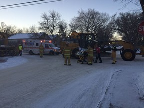 A man was struck by a road grader in Regina on Monday morning.