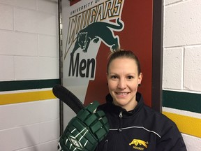 Paige Pyett fits in as an assistant coach with the University of Regina Cougars men's hockey team.