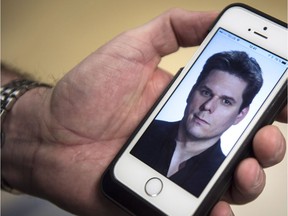 Montreal La Presse columnist Patrick Lagace is seen on a mobile phone screen in this illustration. Numerous surveillance warrants were issued for the columnist's iPhone in 2016 at the request of the city's police service.
