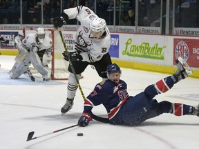 Regina Pats forward Austin Wagner gets tangled up with Red Deer Rebels defenceman Josh Mahura during a WHL game at the Brandt Centre last season. Mahura was acquired by Regina prior to Tuesday's WHL trade deadline.