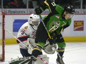 Regina Pats goalie Kurtis Chapman is screened by Prince Albert Raiders forward Parker Kelly during WHL action at the Brandt Centre on Saturday.