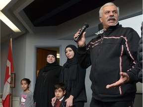 Naif Khuwailed, right, speaks while his wife, daughter and grandchildren look on during a World Religion Day Celebration organized by Regina Multifaith Forum at Beth Jacob Synagogue. The Syrian family arrived in Regina on Dec. 16, 2016 from a refugee camp in Lebanon.