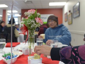 People start on the salad course at an "Elegant Dinner" hosted by the Salvation Army at Haven of Hope.