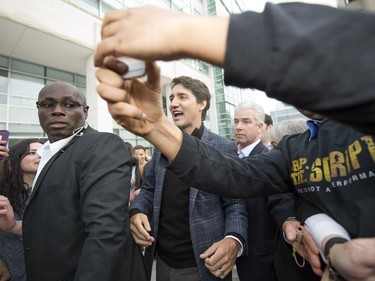 Prime Minister Justin Trudeau takes a selfie during his walking tour on the University of Regina campus in Regina.