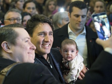 Prime Minister Justin Trudeau takes a selfie during his walking tour on the University of Regina campus.