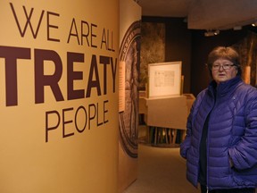 Evelyn Siegfried, curator of aboriginal studies at the Royal Saskatchewan Museum, stands at the entrance of the temporary We Are All Treaty People exhibit at the Royal Saskatchewan Museum in Regina.