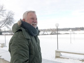 Jim Aho stands near the entrance to the Conexus Arts Centre and Wascana Lake, the site of the upcoming Waskimo Winter Festival.