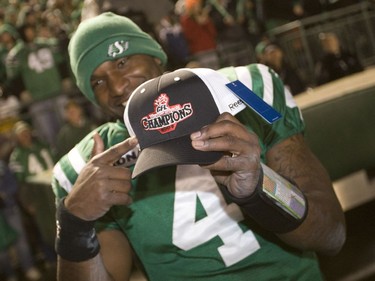 Saskatchewan Roughriders' quarterback Darian Durant points to a West Final Championship hat on after a victory over the Calgary Stampeders in CFL action at Mosaic Stadium in Regina, Sask. on Sunday Nov. 22, 2009.