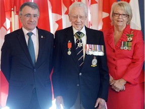 REGINA, SK: MAY 04, 2015 -- His Excellency Nicolas Chapuis (L), Ambassador of France to Canada presented Howard Leyton-Brown (C) of Regina  with the rank of Knight of the French National Order of the Legion of Honour for his role in the liberation of France during the Second World War.