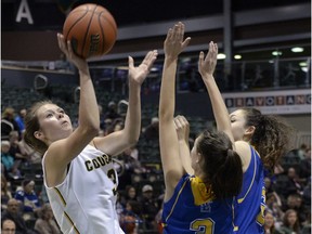 Katie Polischuk, shown on the left in this file photo, is 17 points shy of 1,000 as a member of the University of Regina Cougars women's basketball team.