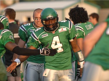 CFL action from Regina, Roughriders vs BC Lions. Darian Durant, #4 is congratrulated on the bench after throwing a TD to #12 Adarius Bowman.