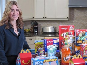University of Ottawa researcher Monique Potvin Kent poses with a selection of food and beverage products marketed to kids on popular websites in this undated handout photo. THE CANADIAN PRESS/HO - Heart and Stroke Foundation *MANDATORY CREDIT*