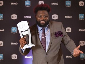 Calgary Stampeders offensive lineman Derek Dennis poses backstage after being named Most Outstanding Offensive Lineman at the CFL Awards held in Toronto on November 24, 2016. Former CFL teammates Derek Dennis and Charleston Hughes took turns issuing verbal jabs on social media Tuesday.Dennis, the CFL&#039;s top lineman last year, took to Twitter to post a video gently reminding the league&#039;s pass rushers that he&#039;s working hard preparing for the 2017 season. Last week, Dennis signed as a free agent wit