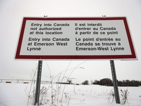 A sign is seen near Emerson, Man. Thursday, February 9, 2016. Refugees had been crossing the closed border port into Canada at Emerson and authorities had a town hall meeting in Emerson to discuss their options.