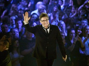 k.d. lang waves to the crod after receiving a Juno for her Canadian Music Hall of Fame induction during the 2013 Juno Awards in Regina on Sunday, April 21, 2013. Four-time Grammy winner k.d. lang will mark the success of her 1992 hit single &ampquot;Constant Craving&ampquot; and its album &ampquot;Ingenue&ampquot; with a 17-city Canadian tour. THE CANADIAN PRESS/Liam Richards