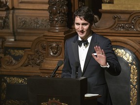 Canadian Prime Minister, Justin Trudeau, speaks during the annual Matthiae banquet at the town hall in Hamburg, Germany, Friday, Feb. 17, 2017. Trudeau and  German Minister of Foreign Affairs, Sigmar Gabriel, are honourary guests at the oldest banquet in the world that is traditionally held by the government of the Hanse city, Hamburg, since 1356. (Axel Heimken/dpa via AP) ORG XMIT: LON842