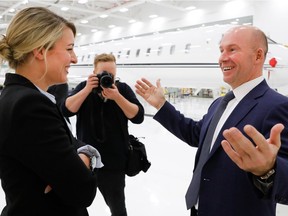 Federal minister Melanie Joly smiles as she speaks with Bombardier CEO Alain Bellemare after a press conference at Bombardier in Montreal on Tuesday February 7, 2017. The federal government says it will give Bombardier $372.5 million in repayable loans over four years to support the Global 7000 and CSeries aircraft projects.