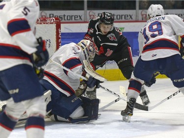 Moose Jaw Warriors forward Brayden Klatt, 19, slaps at Regina Pats goalie Tyler Brown's pad during the 2nd period.