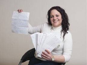 Sherri Maier holds a handful of some 500 letters she wrote to her fiancé while he was serving time in a federal prison.