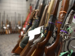 Numerous rifles are displayed during a press conference at Regina Police Service. 157 guns turned in through the RPS's gun amnesty program.