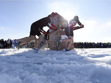 Teams compete in the Outhouse Races during Waskimo held on Wascana Lake in Regina.