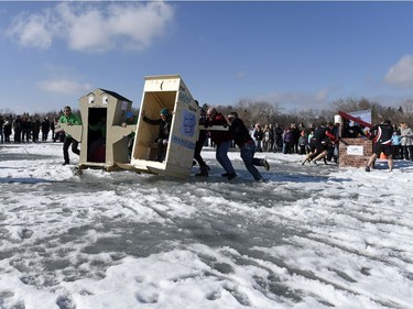 Teams compete in the Outhouse Races during Waskimo held on Wascana Lake in Regina.