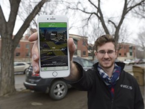 Kyle Smyth, a cofounder of Offstreet, stands in an unused parking spot near the General Hospital. Offstreet is an app that helps people rent their unused parking spaces.