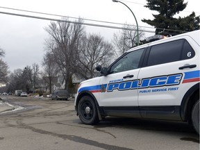 Regina Police Service members take up a position at the 1300 block of Athol Street.