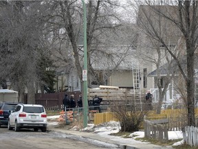 Regina Police Service members take up a position at the 1300 block of Athol St.