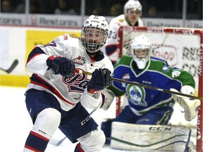 The Regina Pats' Kjell Kjemhus, left, made his WHL debut Sunday against the Swift Current Broncos.