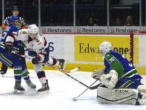 Swift Current Broncos goalie Taz Burman, shown facing a shot from the Regina Pats' Adam Brooks on Sunday, was a major reason why the visitors posted a 5-4 overtime victory at the Brandt Centre.
