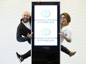 Skye Kaiss, left, owner of Evolution Fitness, and Korena Lafayette, director of operations, pose with the new signage at Evolution Fitness in Regina.  The gym is formally known as Gold's Gym.
