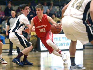 Raymond Comets guard Chase Bohne bolts around Luther Lions guard Callan WIllimott at the Luther Invitational Tournament held at the Luther College High School gym.