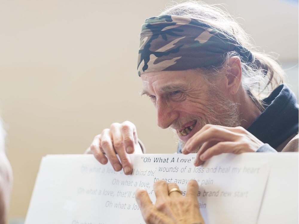 REGINA, SASK : January 30, 2017 - Ed Stamm, member of the Reel Anti-Suppressants Popular Theatre Group, laughs as he holds up some printed lyrics while Bob Hughes, left, tapes it to a panel during a rehearsal at the Regina office of the Canadian Mental Health Association. MICHAEL BELL / Regina Leader-Post.