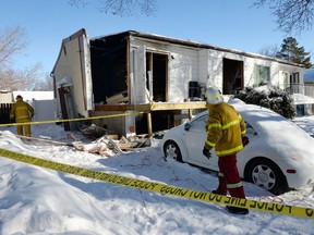 Regina Fire Dept. personnel do a safety audit at 152 Cooper Crescent in Regina on February 25,2015 after an evening explosion blew the west wall off the house and sent three occupants to hospital.