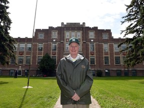 Gordon Currie is shown in front of Balfour Collegiate, where he was an accomplished coach, in 2014.